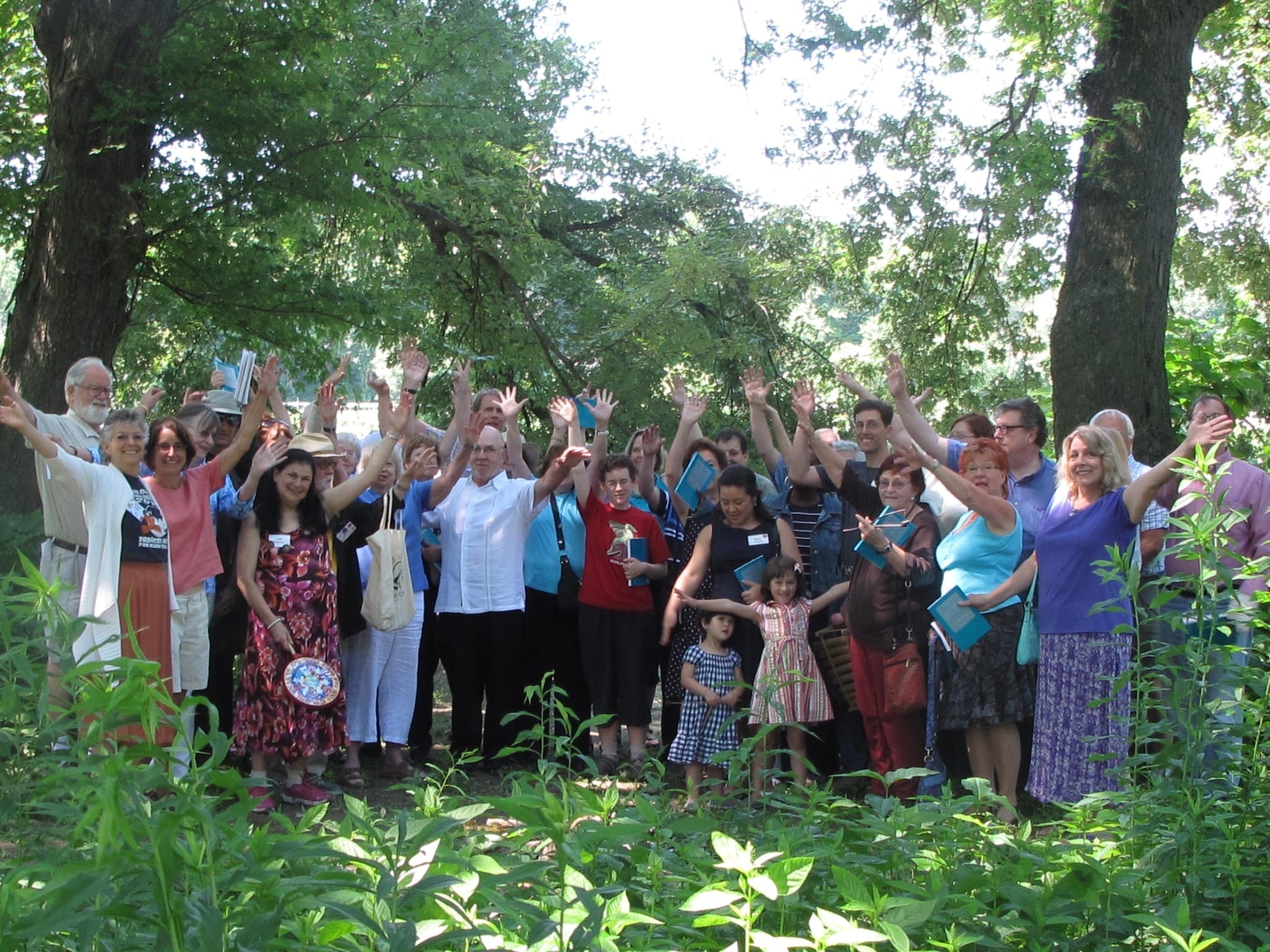UUCB Big Group Gathered arms up